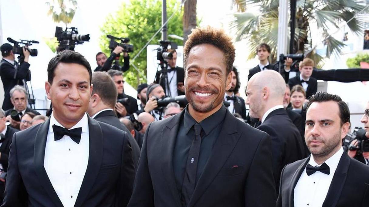 Le producteur et réalisateur marocain (à gauche) présente son premier film, "Redemption Day", à Cannes. 
