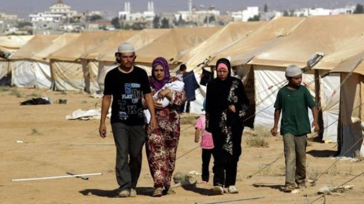 Famille syrienne réfugiée dans le camp jordanien de Zaatari. 

