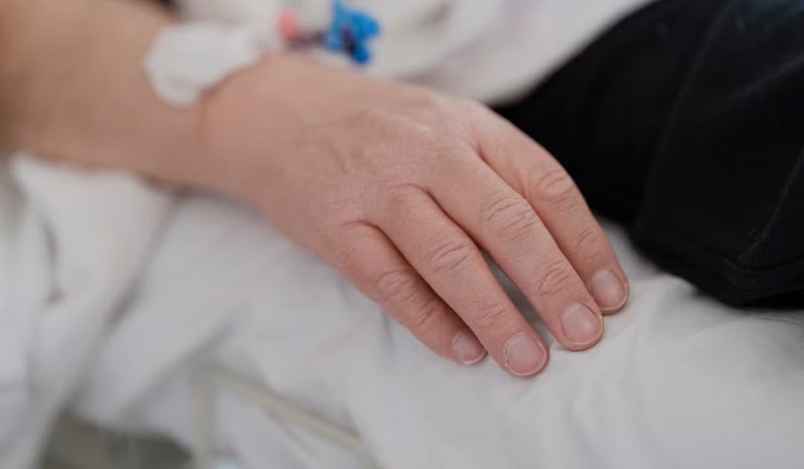 A patient receives medical care at a hospital.