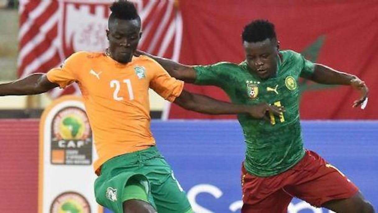 Les joueurs de la Côte d'Ivoire célèbrent leur qualifications pour les quarts de finale de la CAN, après leur victoire contre le Cameroun dans le groupe D, le 28 janvier 2015 à Malabo.
