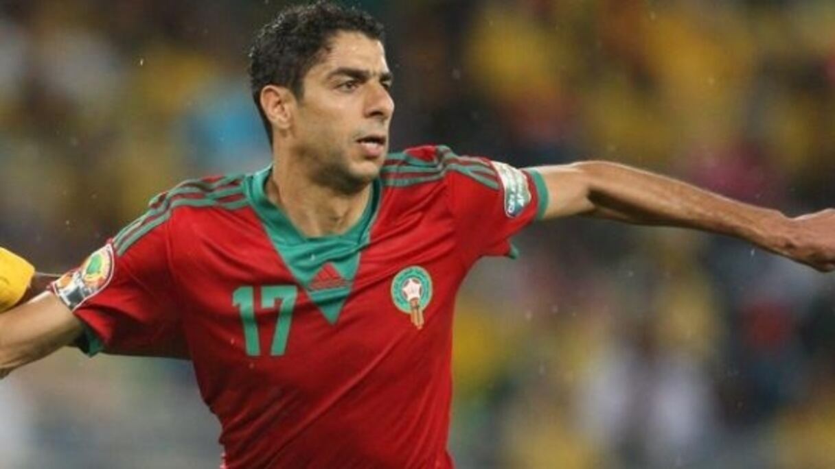 L'international marocain de football, Issam El Adoua.
